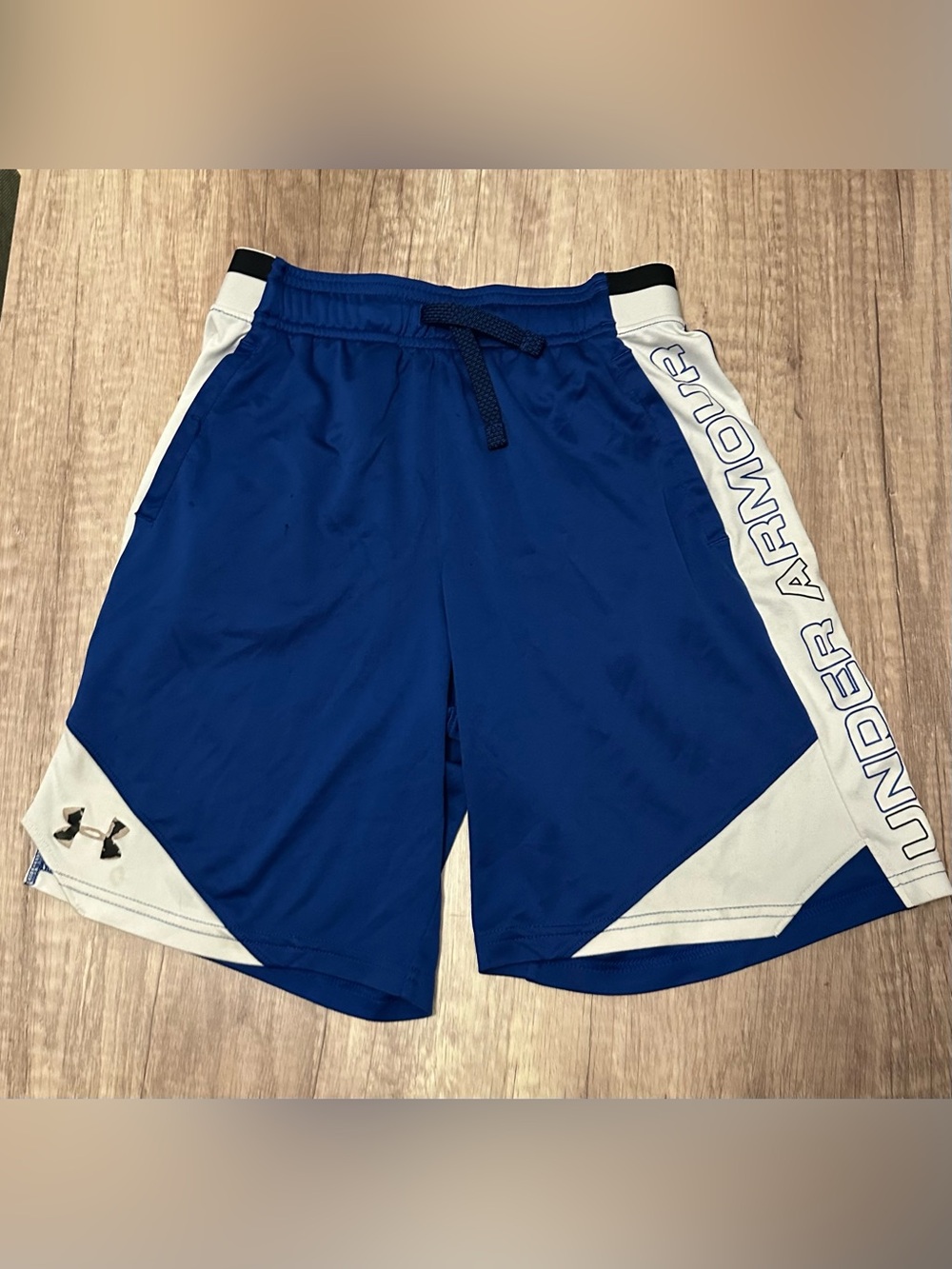 Under Armour blue & white shorts with white side panels and 'UNDER ARMOUR'